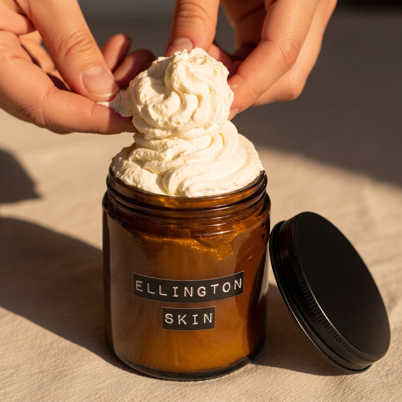 Hands scooping whipped Ellington & Co. from an open jar