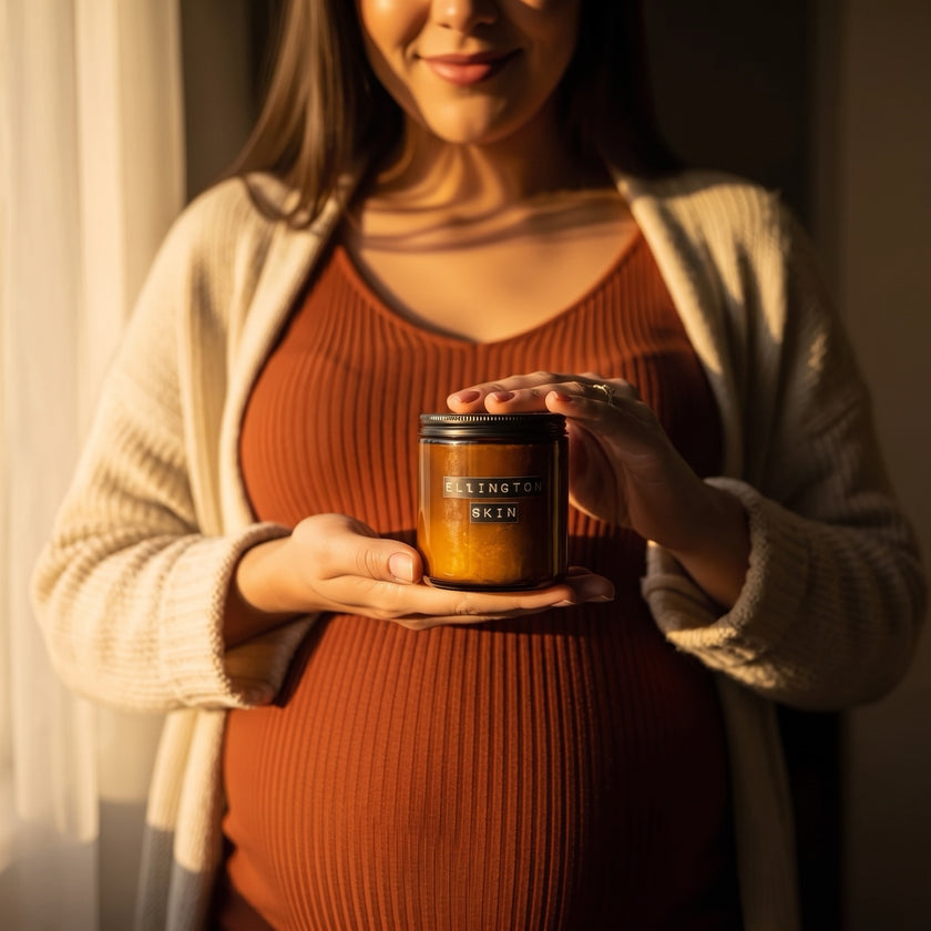 Pregnant woman applying Ellington & Co. to her belly